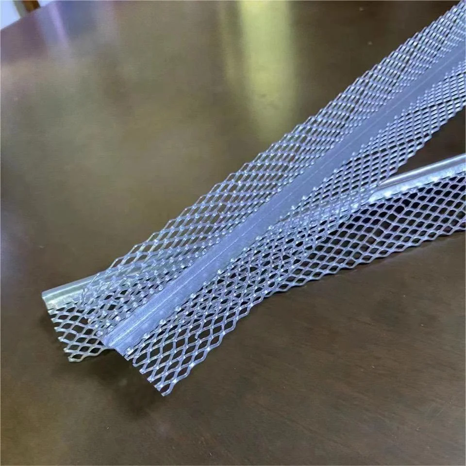 Close-up view of a metal corner bead with attached mesh, placed on a wooden surface, commonly used in construction and plastering.